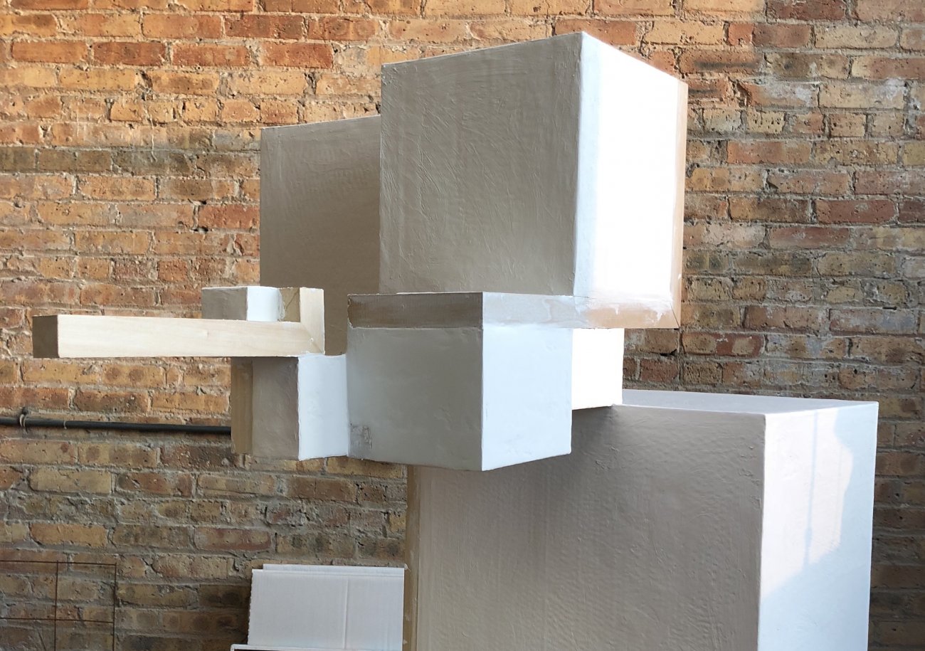 Image of a geometric sculpture in the artists studio.