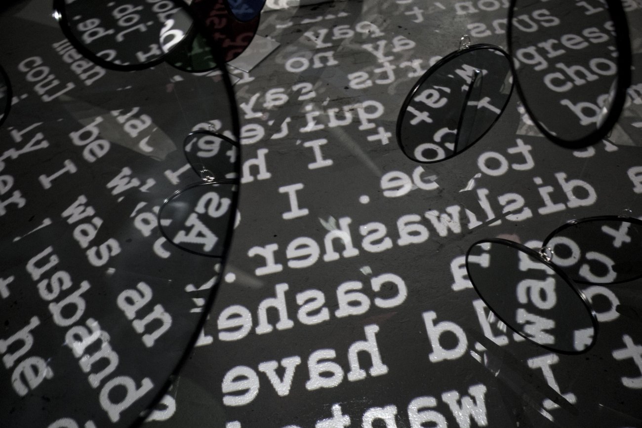 Image image showing and abundance of mirrors and fractured, projected text.