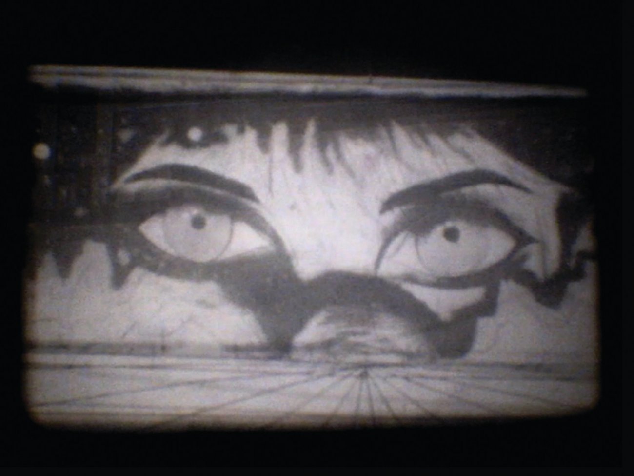 Black and white film still showing animated eyes 